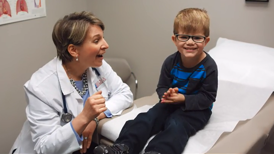 Doctor and child in exam room